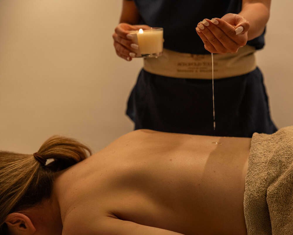 Warm aromatic oil prepared for a body treatment in Athens